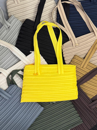 Continuous Zipper Tote Bag ... For days when your bag needs to carry a little bit of everything. Designed with a continuous zipper closure to keep your essentials secure, wherever the day takes you.